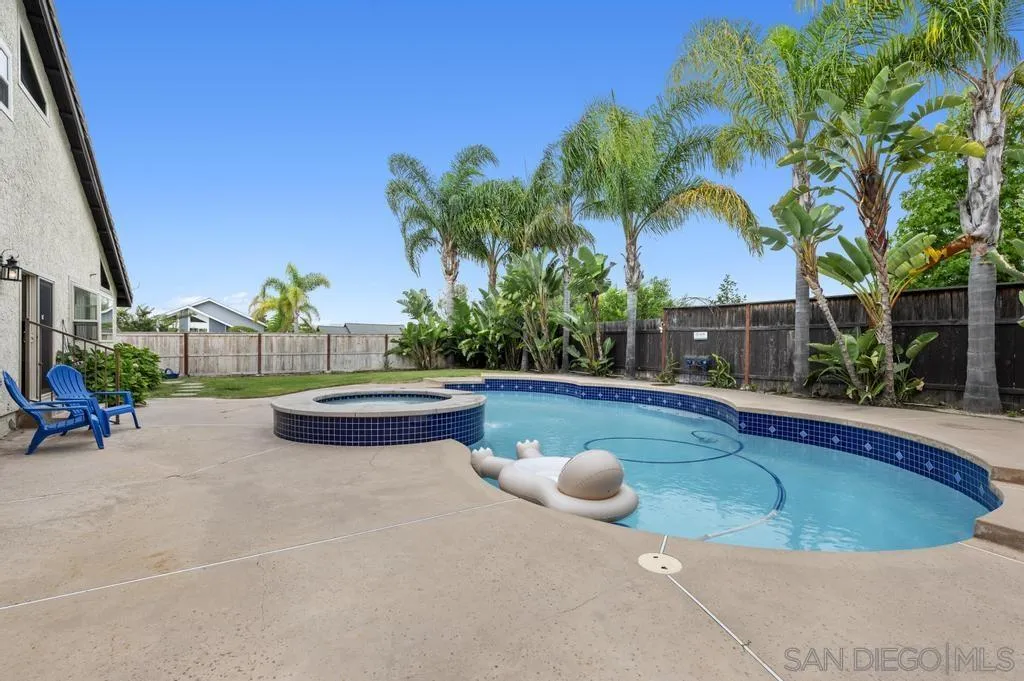 2312 Marca Place Carlsbad, CA 92009 - Photo 43 of 56 a view of swimming pool with outdoor seating and plants