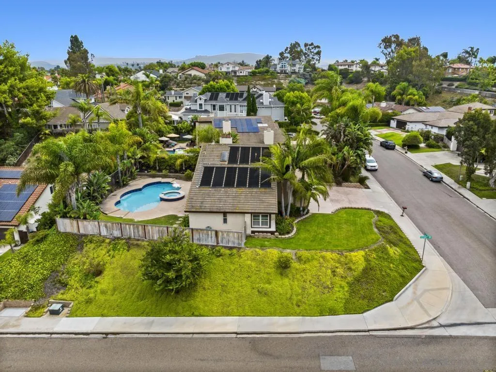 2312 Marca Place Carlsbad, CA 92009 - Photo 48 of 56 an aerial view of a house with a garden and trees