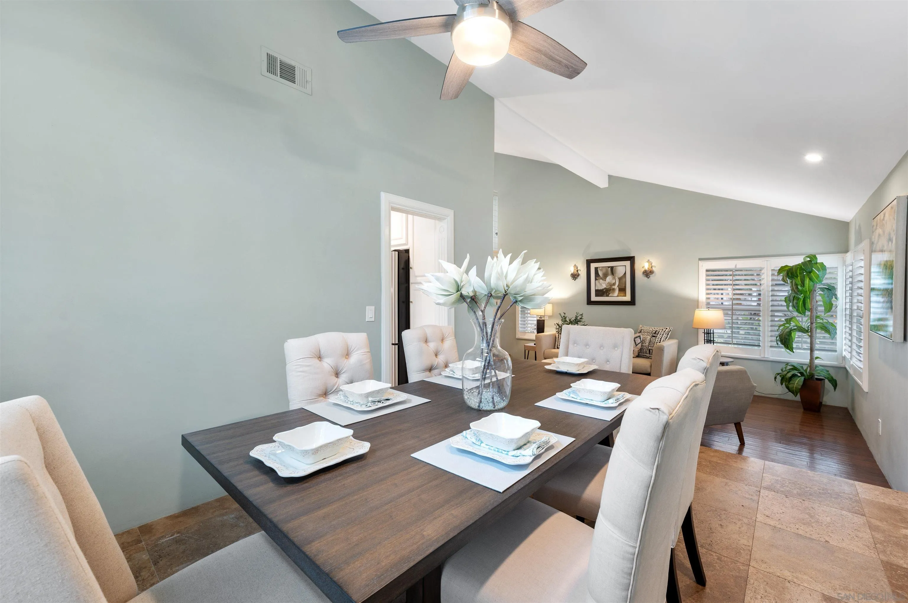 2312 Marca Place Carlsbad, CA 92009 - Photo 10 of 56 a living room with furniture a chandelier and a table