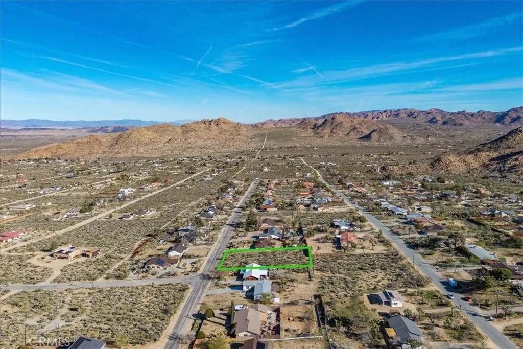 61017 Navajo Joshua Tree, CA 92252 - Photo 22 of 30 an aerial view of residential building and mountain view in back