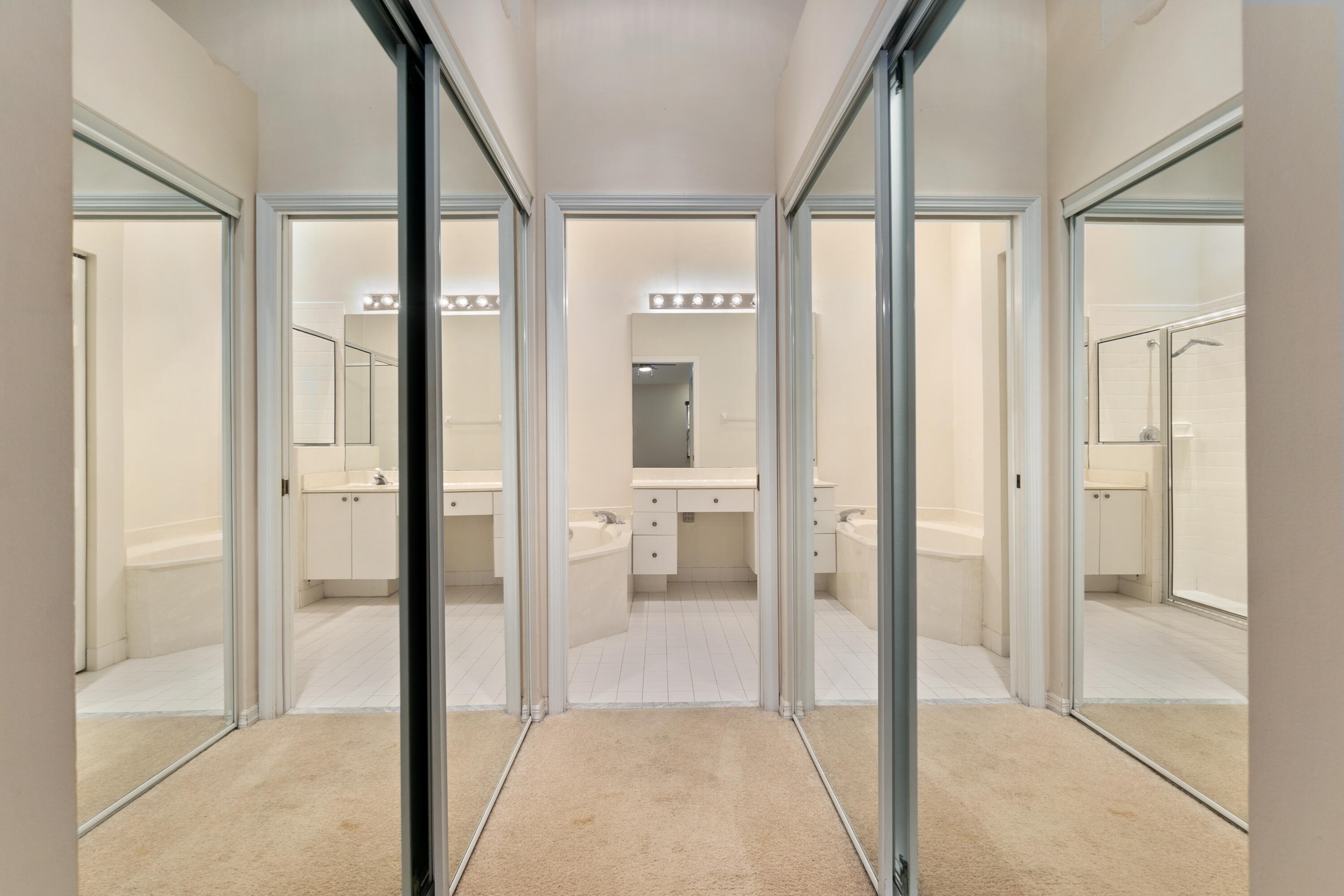 8261 Vía Bella Boca Raton, FL 33496 - Photo 14 of 25 Mirrored closet hallway from master bedr