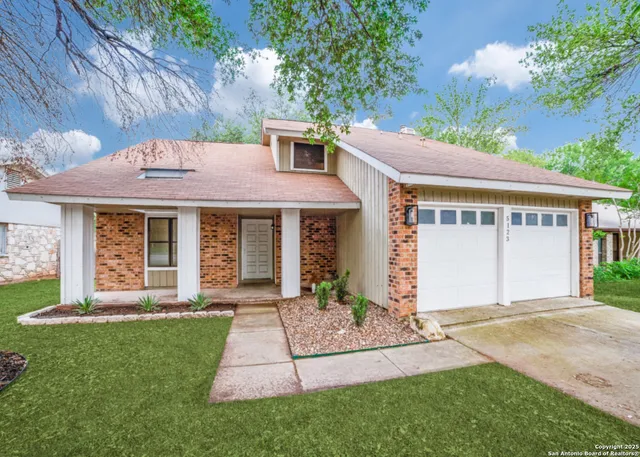 a front view of a house with a yard and porch