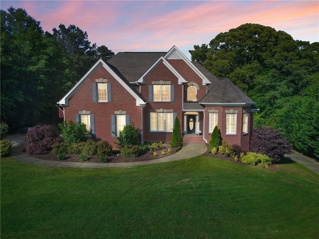 a front view of a house with a yard