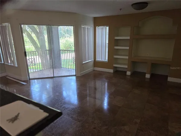 a view of an empty room with a window