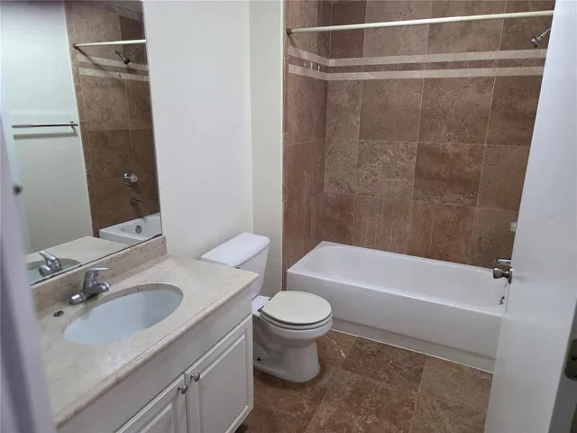 a bathroom with a sink a toilet and a bathtub