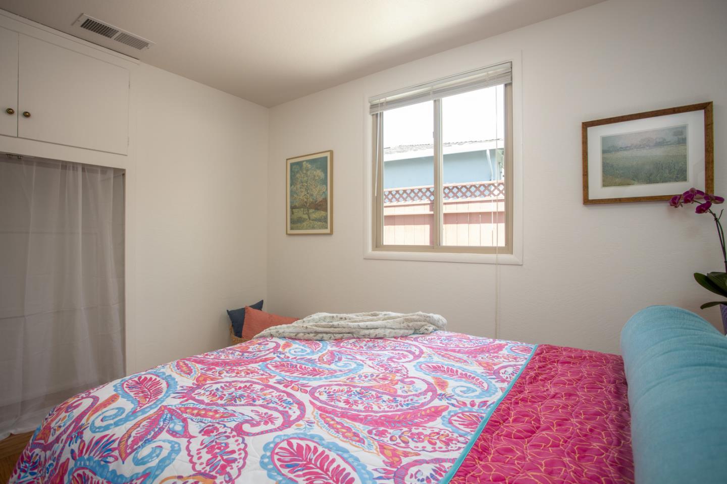 932 Crespi Drive Pacifica, CA 94044 - Photo 13 of 26 a bedroom with a bed and a window