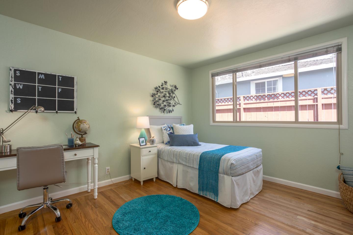 932 Crespi Drive Pacifica, CA 94044 - Photo 15 of 26 a bedroom with a bed and a window