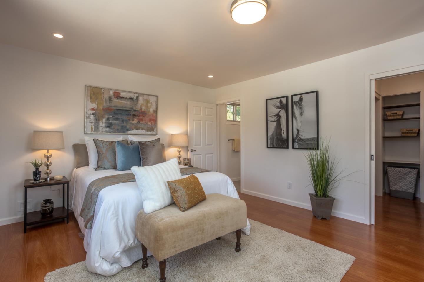 932 Crespi Drive Pacifica, CA 94044 - Photo 20 of 26 a bed room with a bed and a potted plant