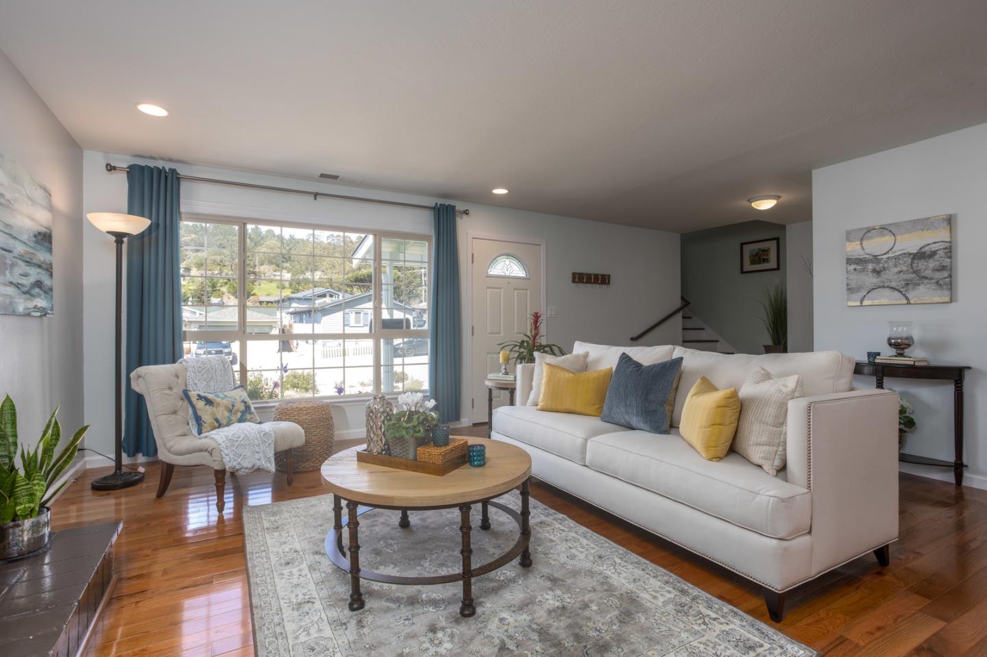 932 Crespi Drive Pacifica, CA 94044 - Photo 4 of 26 a living room with furniture and a large window