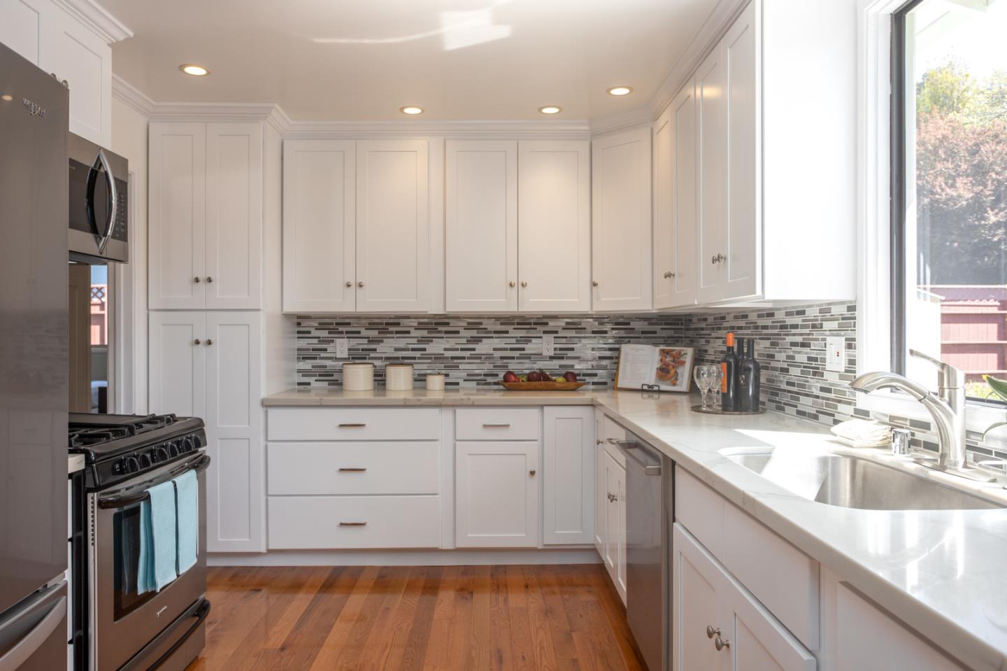 932 Crespi Drive Pacifica, CA 94044 - Photo 9 of 26 a kitchen that has a sink and a stove in it
