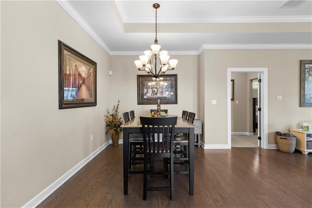 225 Brookside Drive Cranberry Township, PA 16066 - Photo 11 of 34 a view of a dining room with furniture window and wooden floor