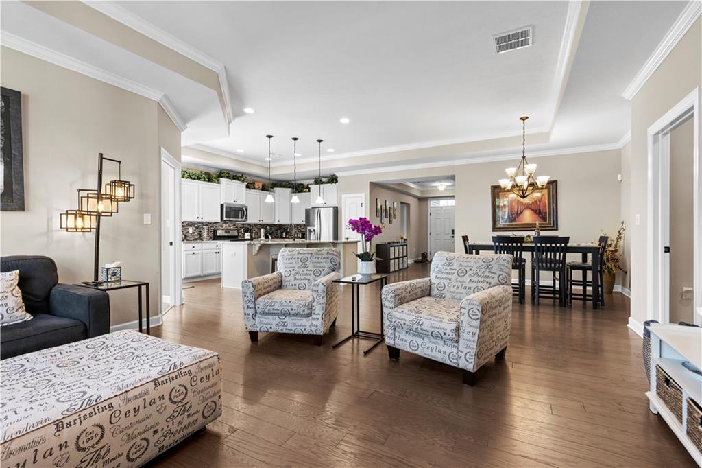 225 Brookside Drive Cranberry Township, PA 16066 - Photo 12 of 34 a living room with furniture and a chandelier