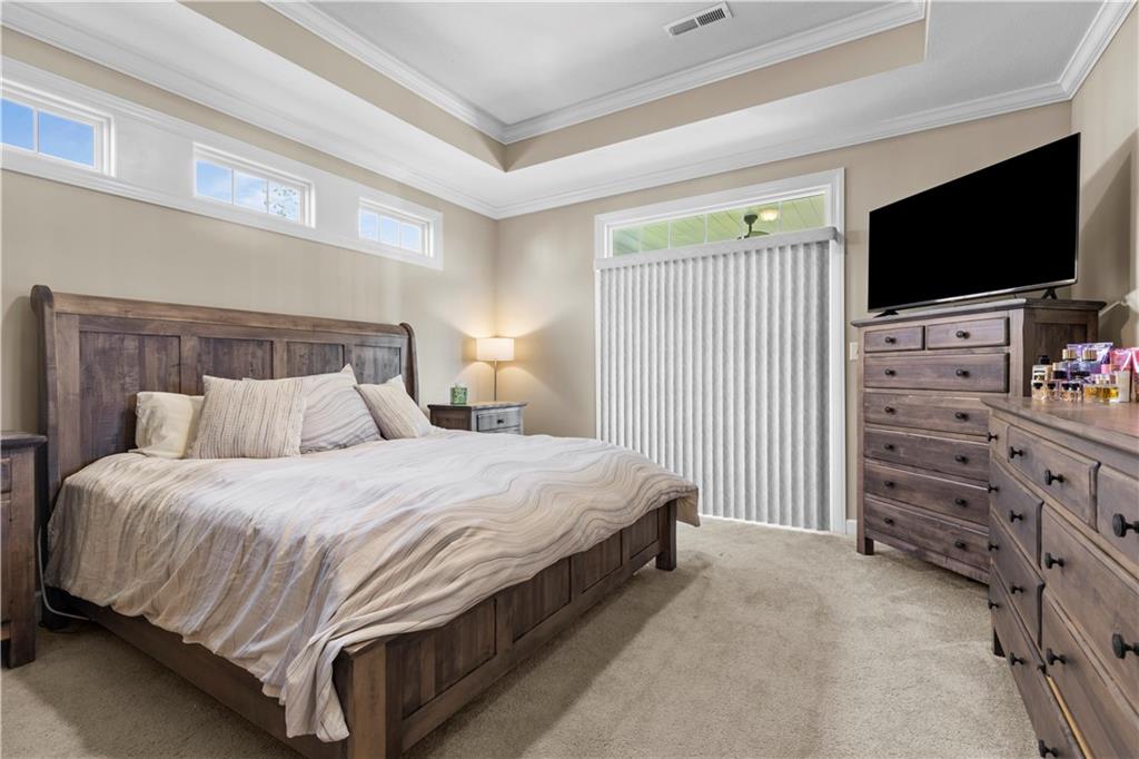 225 Brookside Drive Cranberry Township, PA 16066 - Photo 15 of 34 a spacious bedroom with a bed and a flat screen tv