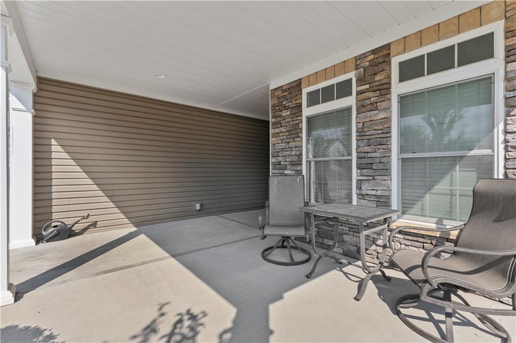 225 Brookside Drive Cranberry Township, PA 16066 - Photo 2 of 34 a view of a two chairs in the patio
