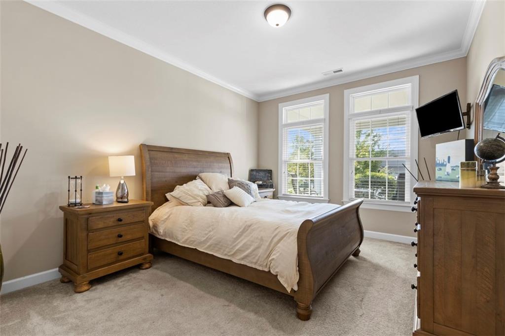 225 Brookside Drive Cranberry Township, PA 16066 - Photo 22 of 34 a bedroom with a bed and a flat tv screen on dresser