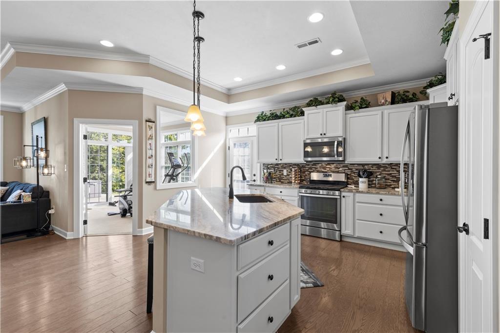 225 Brookside Drive Cranberry Township, PA 16066 - Photo 8 of 34 a kitchen with white cabinets and white appliances