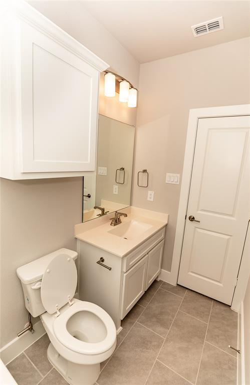 6124 Shasta Creek Road Celina, TX 75009 - Photo 20 of 27 a bathroom with a sink toilet and mirror