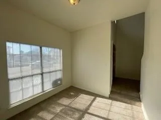 a view of an empty room and window