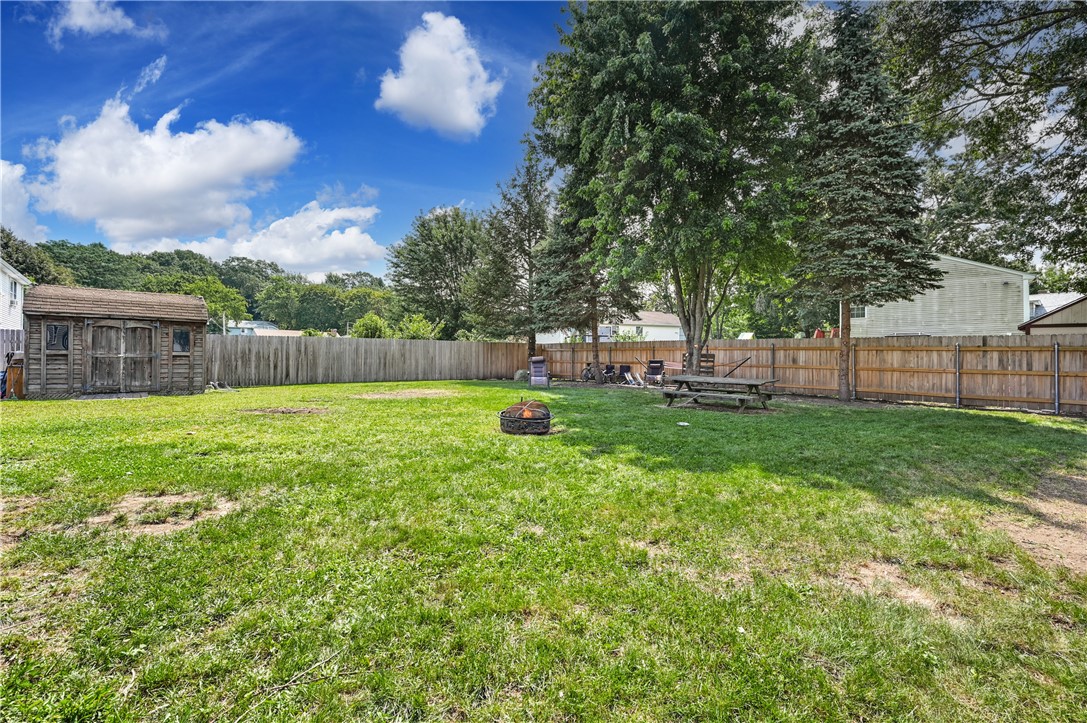 45 Baxter Street Woonsocket, RI 02895 - Photo 26 of 31 Fenced in backyard with storage shed