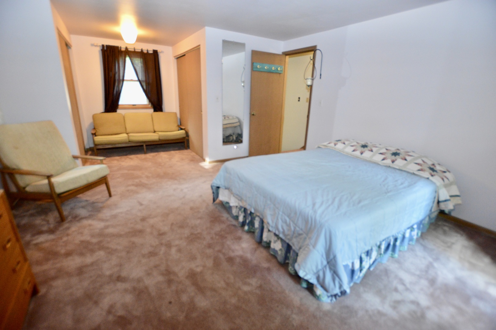 10905 Breezy Lawn Road Spring Grove, IL 60081 - Photo 13 of 20 a bedroom with a bed and a couch