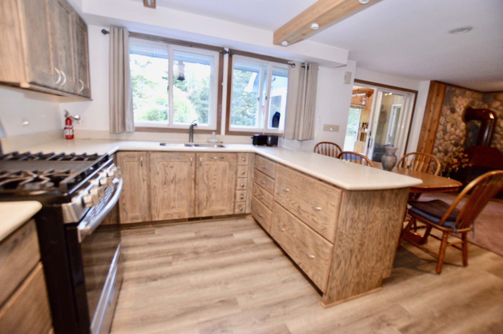10905 Breezy Lawn Road Spring Grove, IL 60081 - Photo 4 of 20 a kitchen with stainless steel appliances granite countertop a sink stove and cabinets