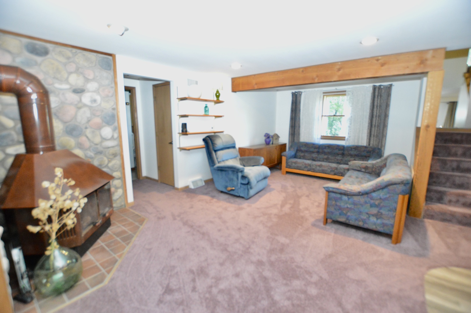 10905 Breezy Lawn Road Spring Grove, IL 60081 - Photo 7 of 20 a living room with furniture and a dining table