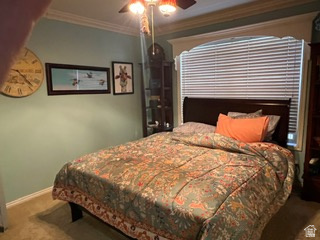 983 Grindelwald Lane, Unit O4 Midway, UT 84049 - Photo 9 of 14 Carpeted interior room featuring a window with horizontal blinds, a dark wood-finish headboard, and a ceiling fan with integrated lighting
