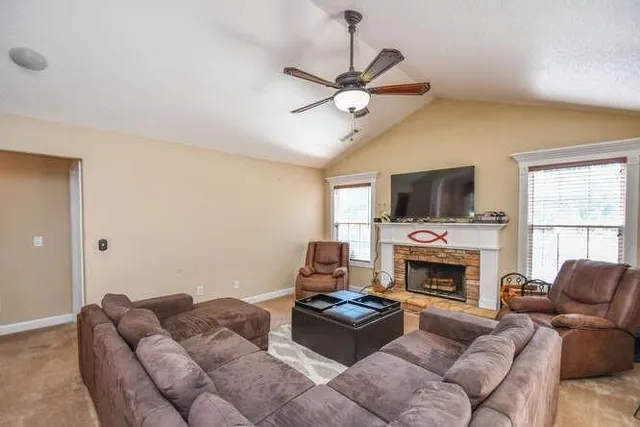 a kitchen with a sink a counter and chairs