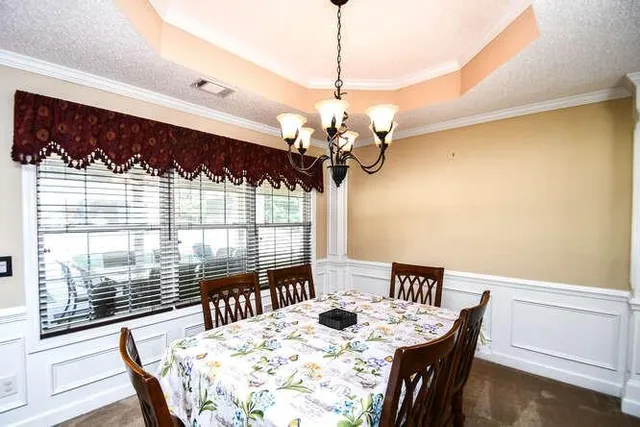 a kitchen with a sink a stove and a wooden cabinets