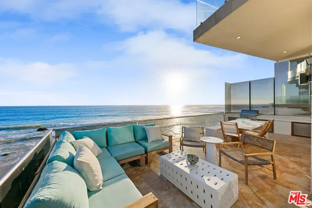 a view of a room with an empty space and wooden floor