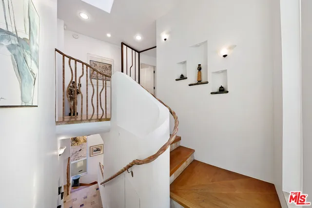 a bedroom with a bed and large window