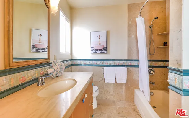 a bedroom with a bed and a table