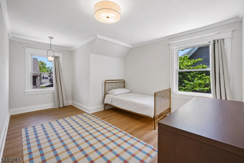 10 Mountain Place Montclair, NJ 07043 - Photo 10 of 21 a bedroom with a bed and a window