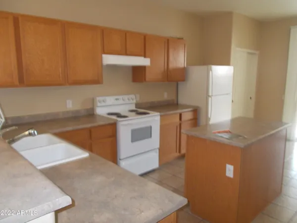 a kitchen with a stove and a sink
