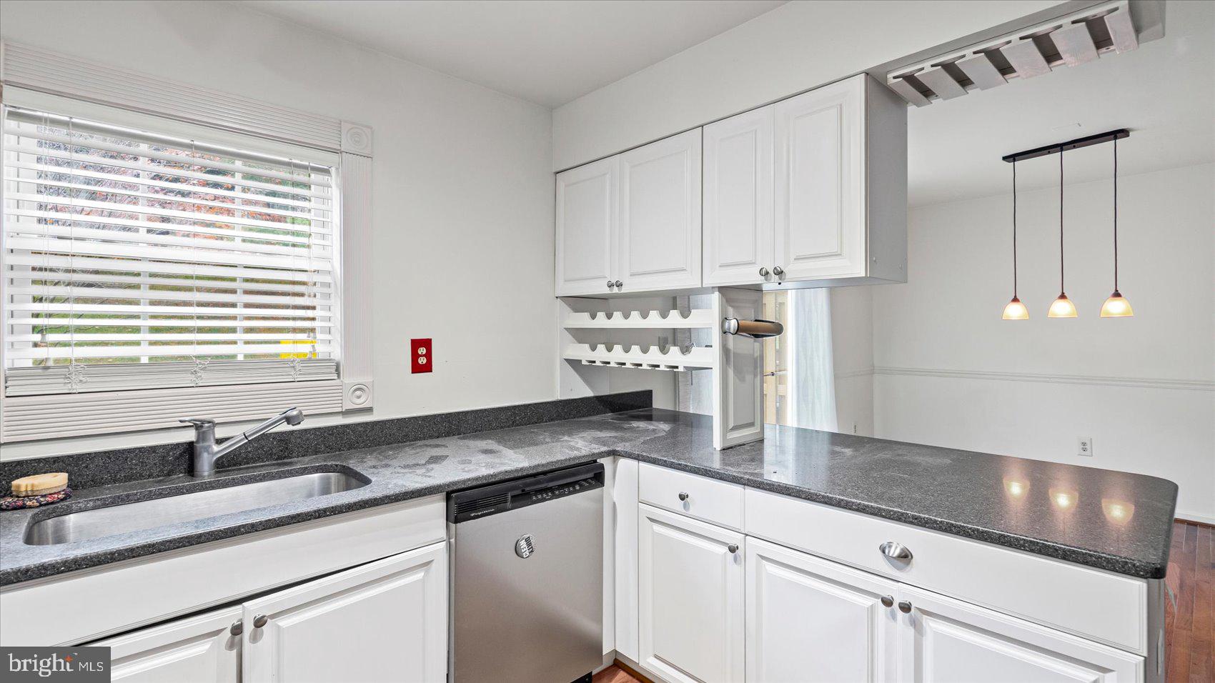 12 Mayapple Court Towson, MD 21286 - Photo 19 of 41 a kitchen with stainless steel appliances granite countertop a sink and a white cabinets