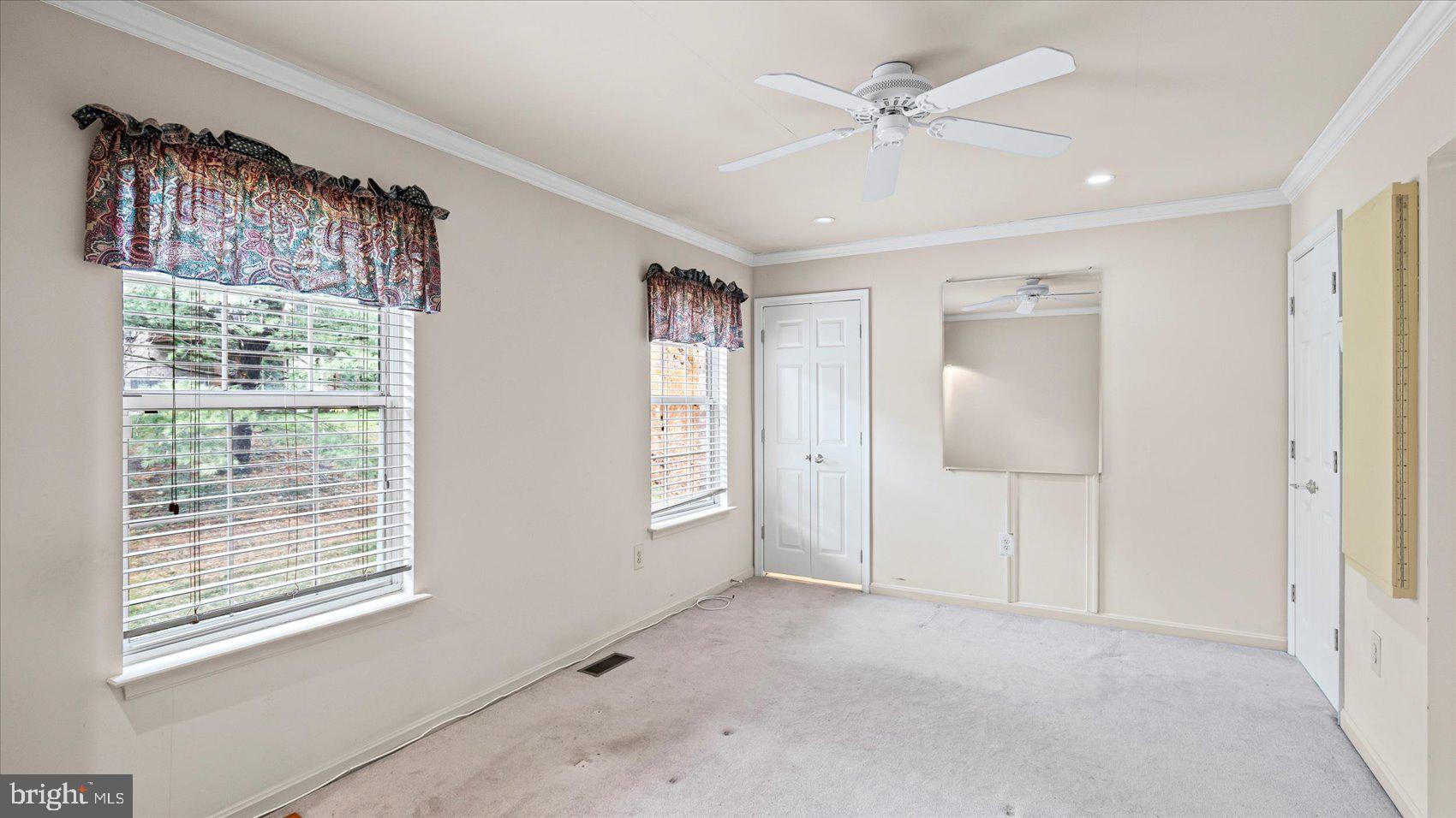 12 Mayapple Court Towson, MD 21286 - Photo 23 of 41 a view of an empty room with a window and a kitchen