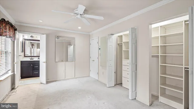 a view of an empty room with a kitchen