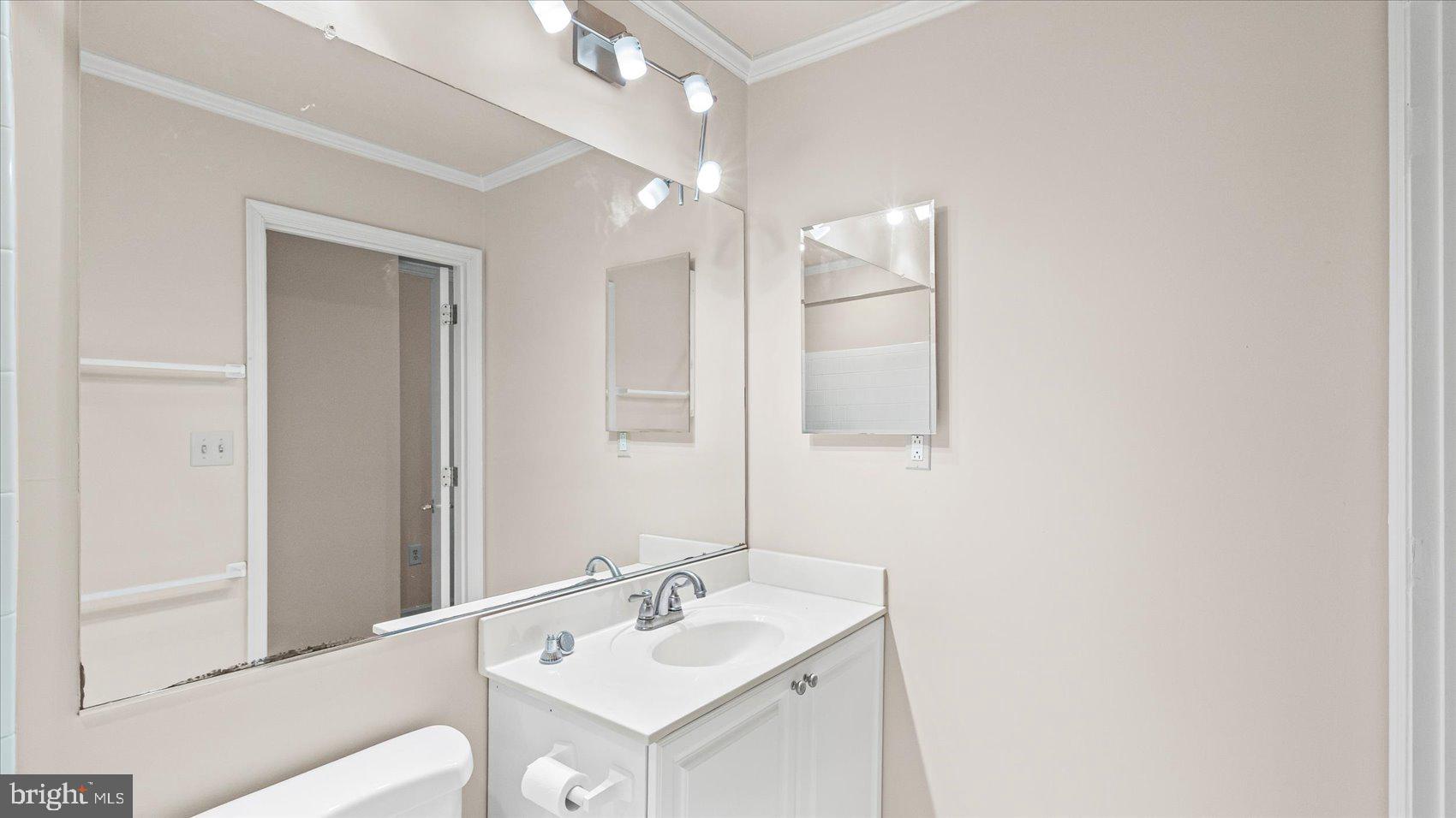 12 Mayapple Court Towson, MD 21286 - Photo 27 of 41 a bathroom with a sink mirror and vanity