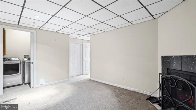 a view of a hallway with wooden floor and entryway
