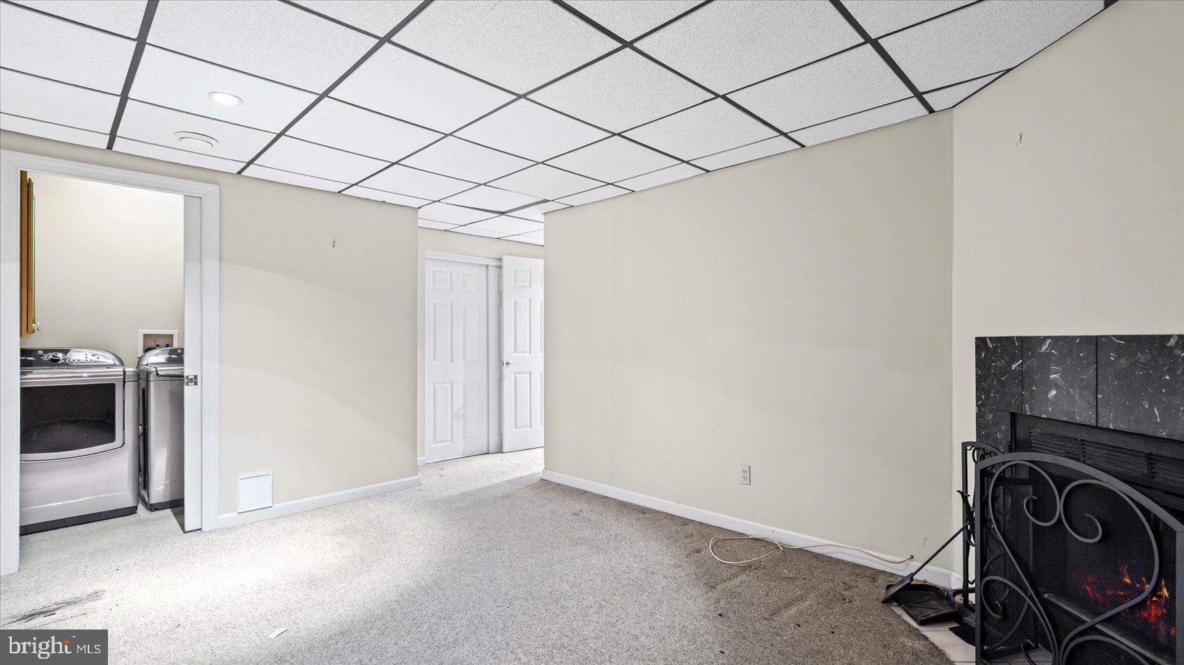 12 Mayapple Court Towson, MD 21286 - Photo 33 of 41 a view of a storage & utility room with washer and dryer