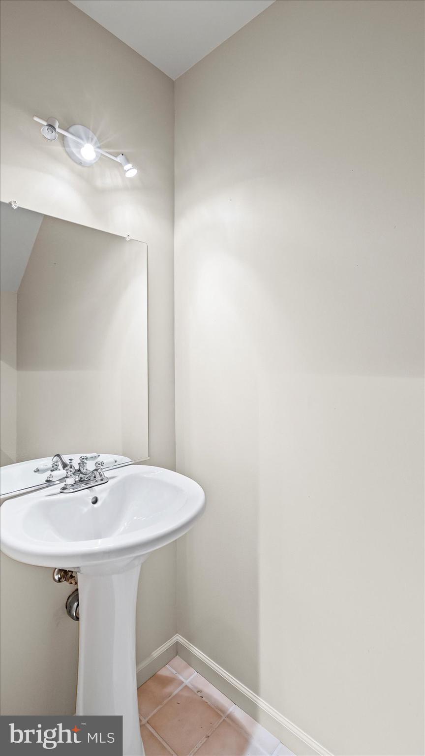 12 Mayapple Court Towson, MD 21286 - Photo 35 of 41 a bathroom with a sink and a mirror