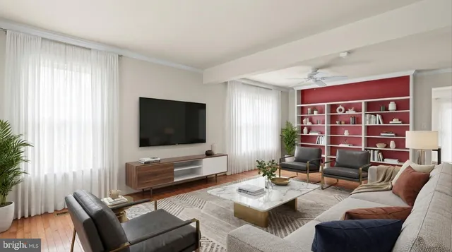 a living room with furniture and a flat screen tv