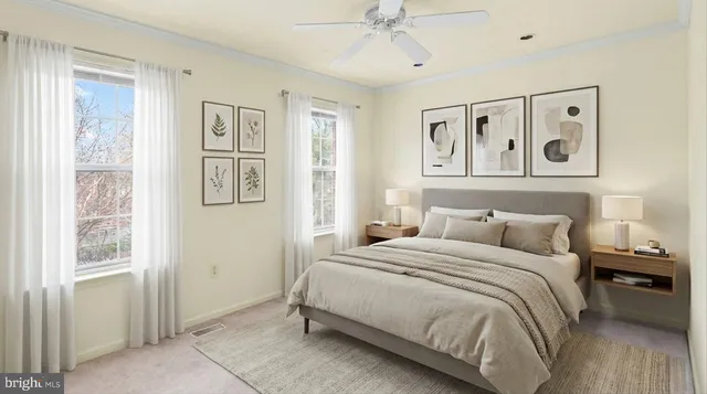 a bedroom with a large bed and a window