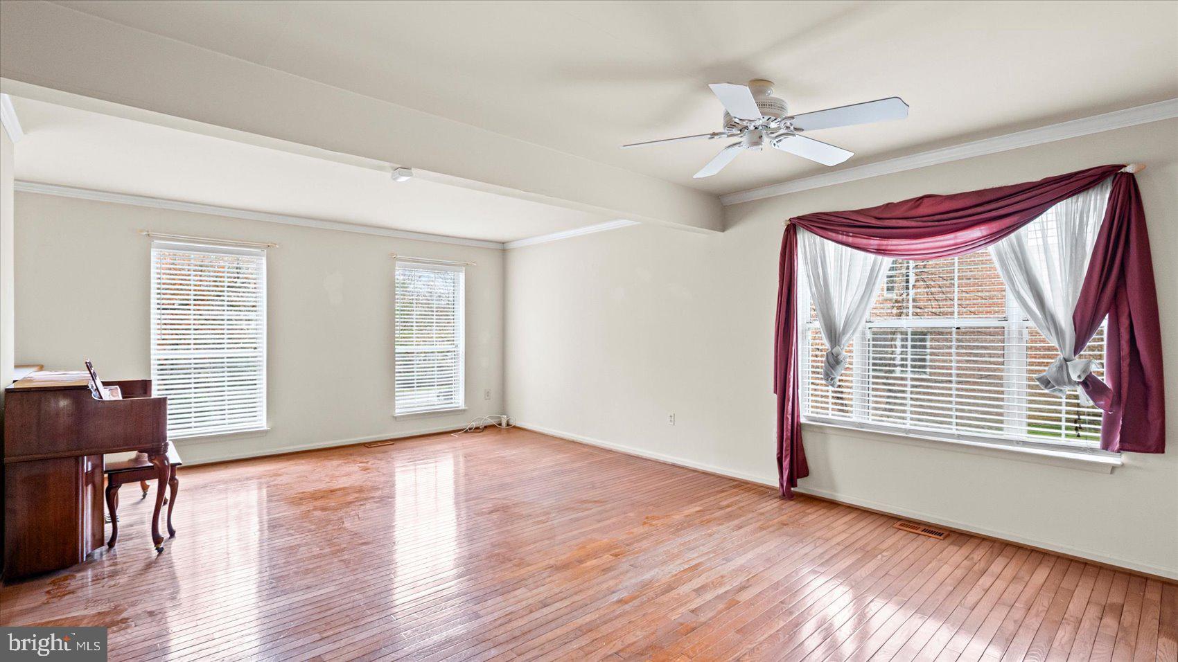 12 Mayapple Court Towson, MD 21286 - Photo 8 of 41 a view of a livingroom with wooden floor and a ceiling fan