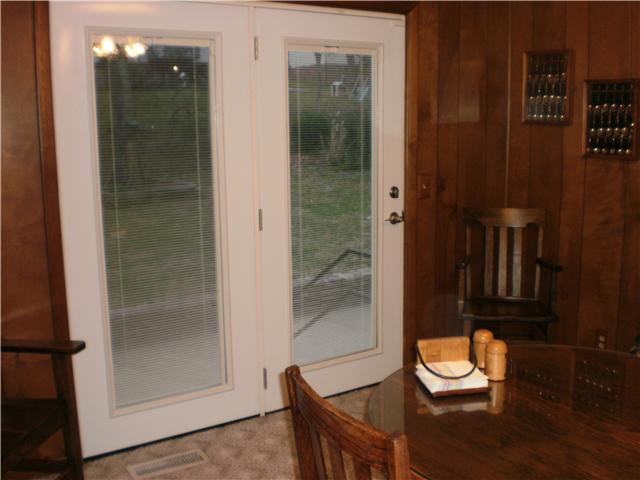 535 Rural Hill Road Nashville, TN 37217 - Photo 11 of 20 Here is a shot of the actual French doors mentioned leading to patio. In pics, you can see how this home is a tri-level, black railing goes down to lower level. Which has den w/fireplace, bedroom and full bathroom. An in-law/teenager/master suite.