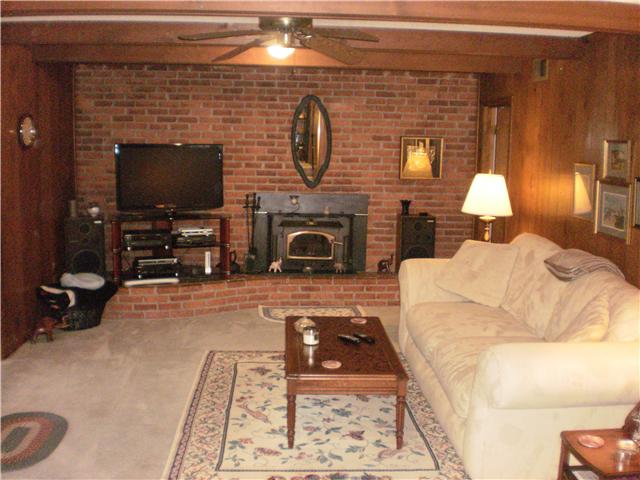 535 Rural Hill Road Nashville, TN 37217 - Photo 15 of 20 View of lower level. There is a Buck stove insert that burns wood. Owner states it will heat the two levels - loves it!!! The brick wall that features the fireplace is beautifully done. Has a curved brick hearth...