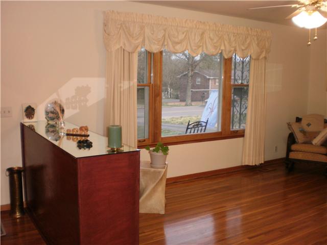 535 Rural Hill Road Nashville, TN 37217 - Photo 5 of 20 This one shows the large front window. Looks out to a covered front porch. Notice the free-standing bookshelf-like built-in on left. Kinda gives you that special entry feel to the room.