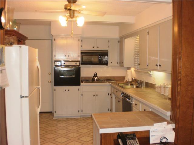 535 Rural Hill Road Nashville, TN 37217 - Photo 7 of 20 Fantastic kitchen, a cook will love it! It was redone in '02. New tile countertops, frig, drop-in stove, dishwasher, lights under cabinets, sink, cabs painted/new hardware. Who doesn't love window over sink?!!