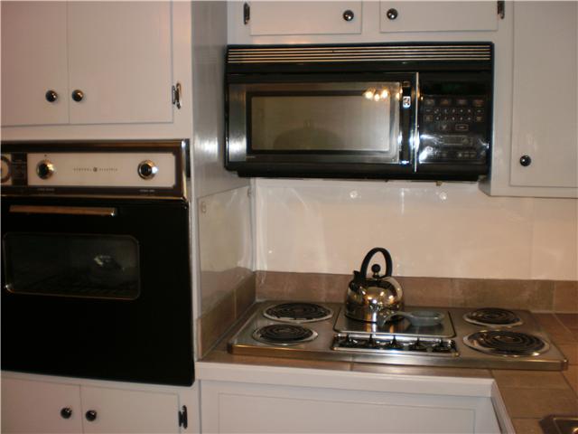 535 Rural Hill Road Nashville, TN 37217 - Photo 9 of 20 This shows the microwave, oven, and the cooktop range. You will impress your guest! The garage door is to the left of oven, is very easy load in of groceries. One level basically - one step to enter. So go shopping - load in out of the rain.