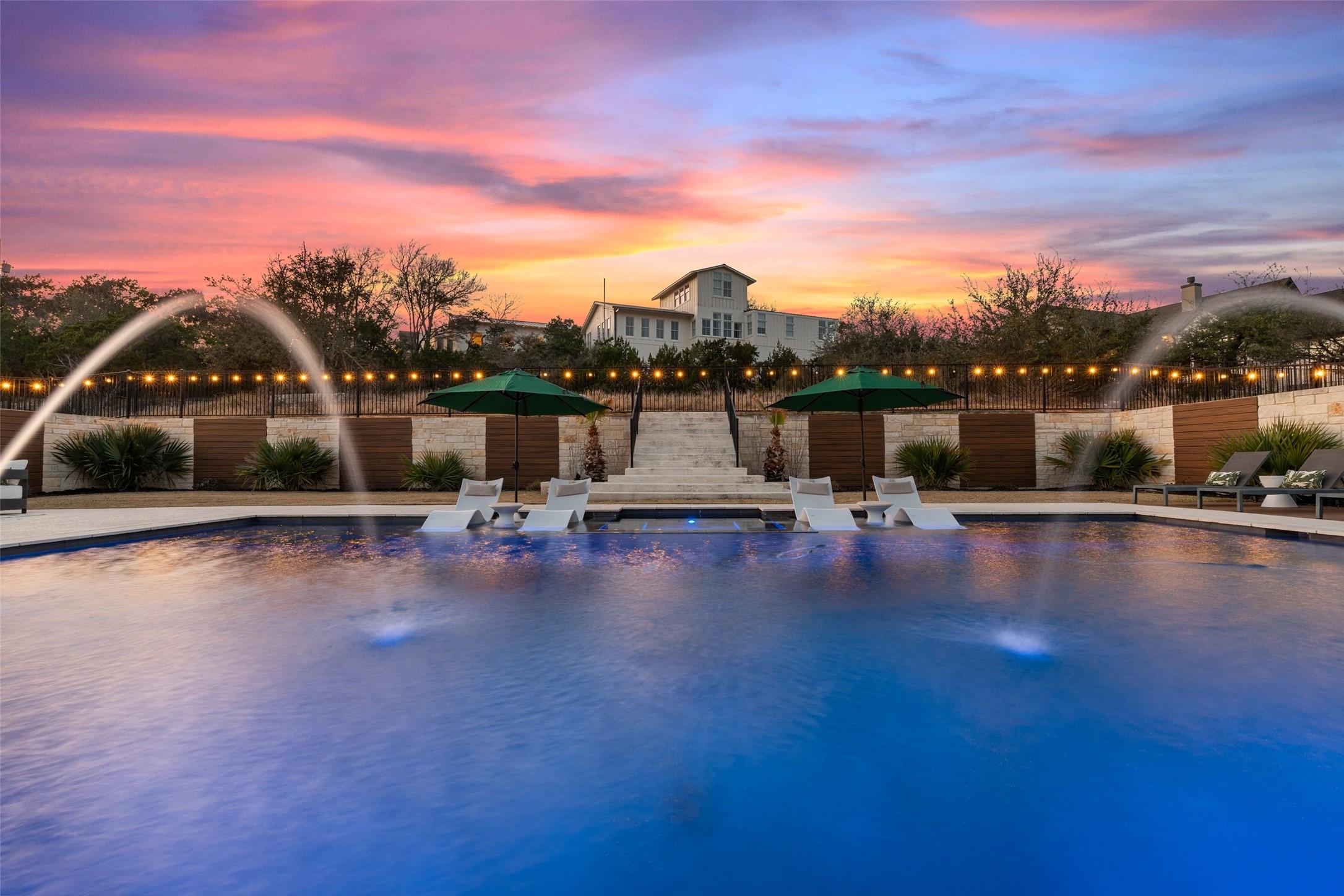 302 Lodestone Lane Austin, TX 78738 - Photo 2 of 40 Gorgeous pool and spa with fountains, patio, and deck with plenty of room for pickleball, firepit and a cabana. With $340,000 in upgrades this fantastic residence is sure to please. It’s all here waiting for you to enjoy the wonderful Lakeway lifestyle.